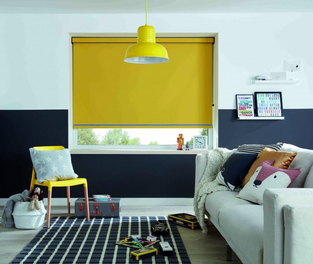 Yellow blackout roller blind in a child’s bedroom